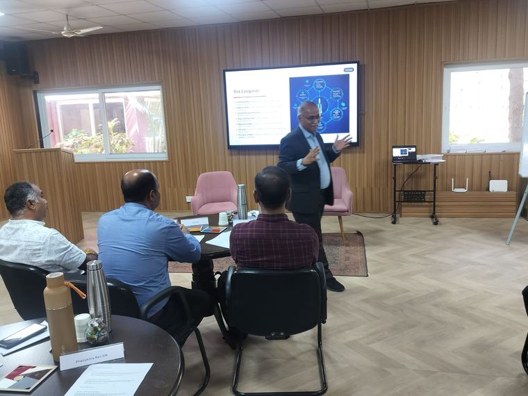 Small-group executive facilitation in a boardroom setting