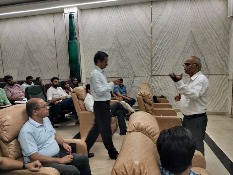 An informal leadership discussion — the setting deliberately relaxed so people say what they actually think.
